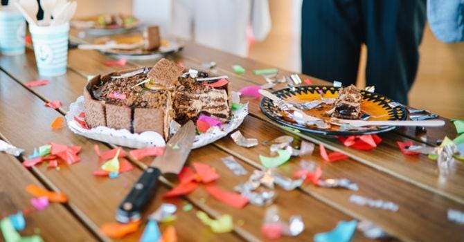 half-eaten cake on a table at an office party