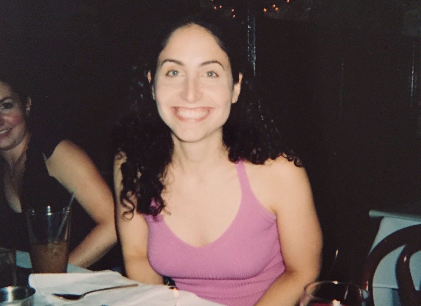 Photo of me smiling widely at my 27th birthday party