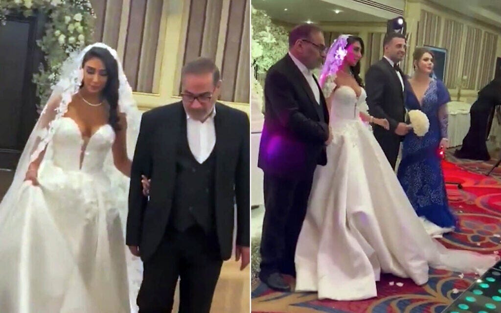 Leaked footage from mid-2024 shows Fatemeh Shamkhani in a Western-style, low-cut strapless wedding dress, left, being led down the aisle by her father Ali Shamkhani, a close adviser to Iran's Supreme Leader Ayatollah Ali Khamenei. (Screen capture: Iran International, used in accordance with Clause 27a of the Copyright Law) Leaked footage from mid-2024 shows Fatemeh Shamkhani in a Western-style, low-cut strapless wedding dress, left, being led down the aisle by her father Ali Shamkhani, a close adviser to Iran's Supreme Leader Ayatollah Ali Khamenei. (Screen capture: Iran International, used in accordance with Clause 27a of the Copyright Law)