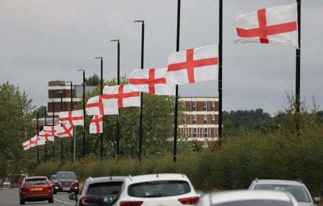 England flags flying on lampposts on Genners Lane along Bartley Reservoir , Bartley Green Birmingham. Fuming Brummies have taken the flag row to the streets by painting the St George???s Cross on mini-roundabouts across the city. It comes as residents have hit out after Birmingham City Council announced English flags hoisted from lampposts would be removed. The Union Jack and St George's flags were put up by locals as part of a movement online called Operation Raise the Colours. Council chiefs sparked fury when they ordered the flags to be ripped down, saying the "unauthorised items" are "dangerous" and could potentially kill motorists and pedestrians. Photo released 19/08/2025