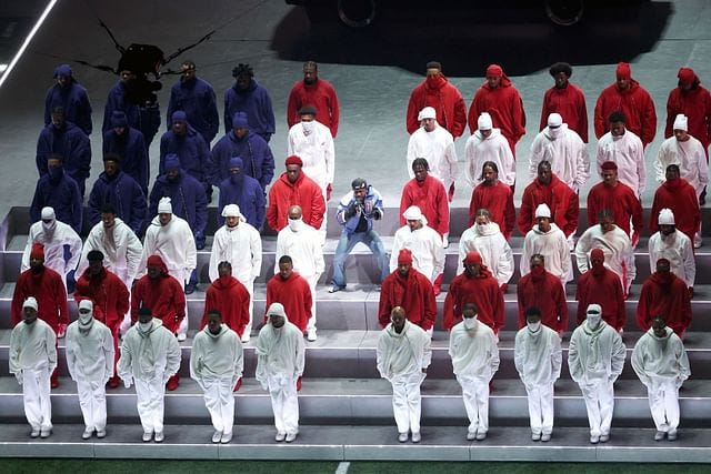 This is so iconic" — Fans react to Kendrick Lamar's dancers forming an  American flag around him during Super Bowl performance
