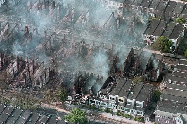 Dozens of houses continue to smolder and collapse the day after the devastating bombing, a grim testament to the destruction. Dozens of houses continue to smolder and collapse the day after the devastating bombing, a grim testament to the destruction.