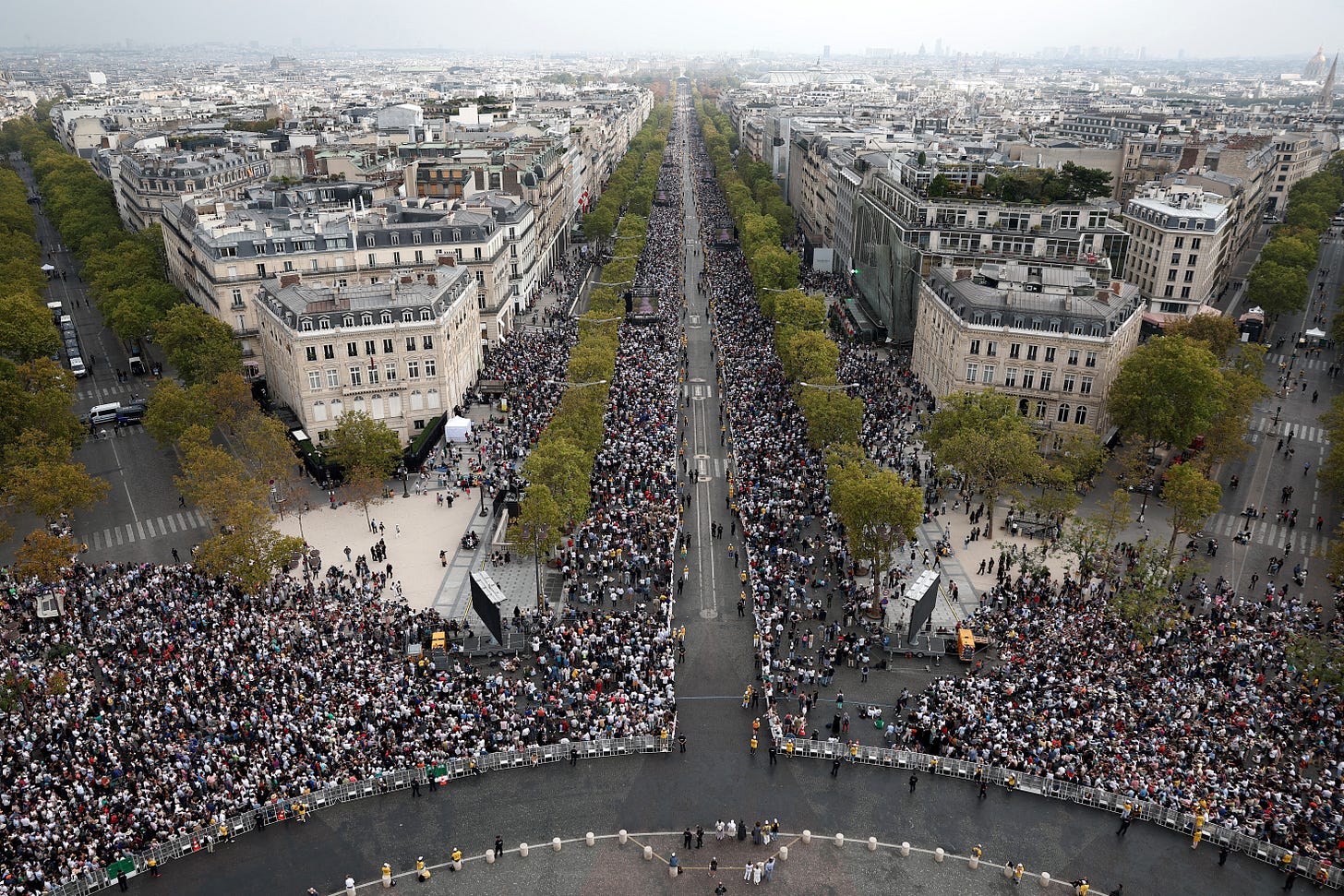 Crowds fill the Champs-Élysées seen from the Arc de Triomphe Crowds fill the Champs-Élysées seen from the Arc de Triomphe