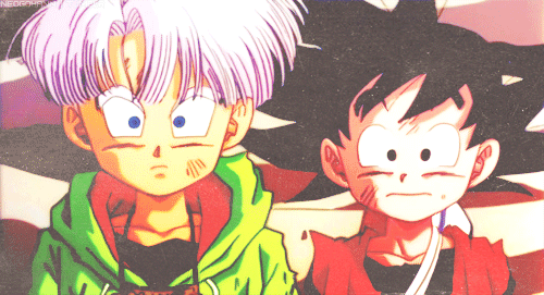 This may contain: two anime characters sitting next to each other