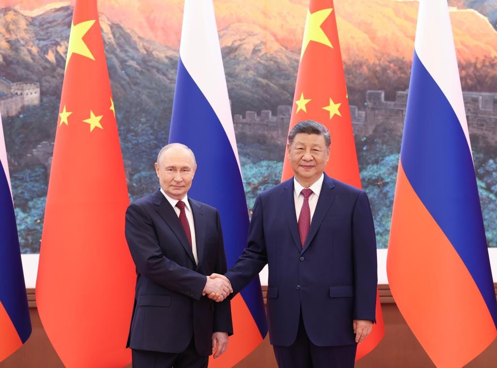 Xi holds talks with Putin in Beijing-Xinhua