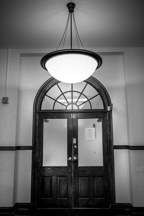 scenes from around campus including a dedication from the Class of 1977, a poem about the alma mater, historical markers, and images of historical hallway in admin building