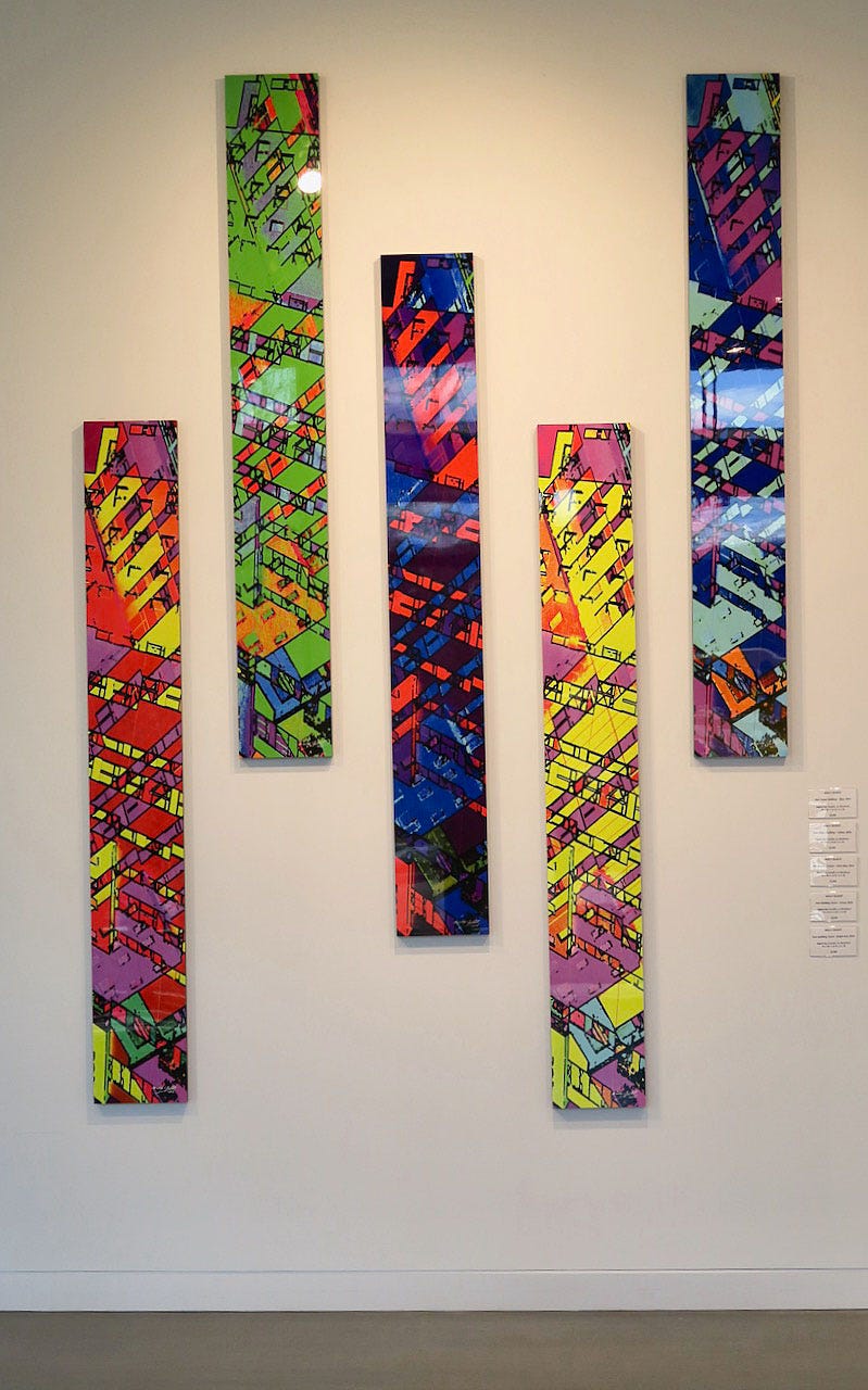 A group of art pieces on a wall

Description automatically generated