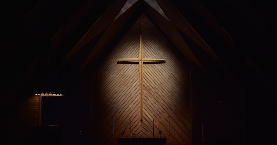 brown wooden cross on brown wooden wall brown wooden cross on brown wooden wall