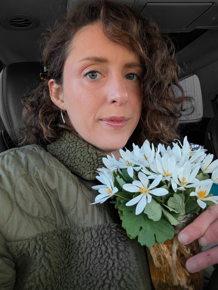 Photo of small white flowers covering a hill. Photo of Martel holding a small bouquet of those flowers.