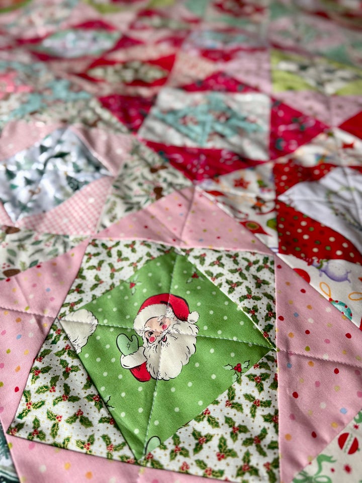 Handmade Christmas quilt in bright, merry fabrics!