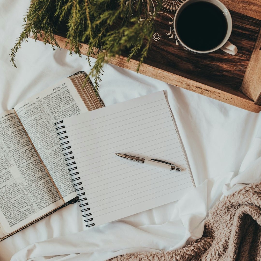 white notebook on white textile white notebook on white textile