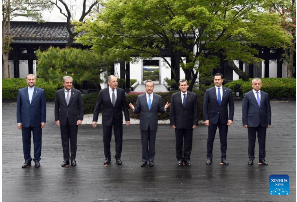 A group of men in suits walking down a street

Description automatically generated with medium confidence