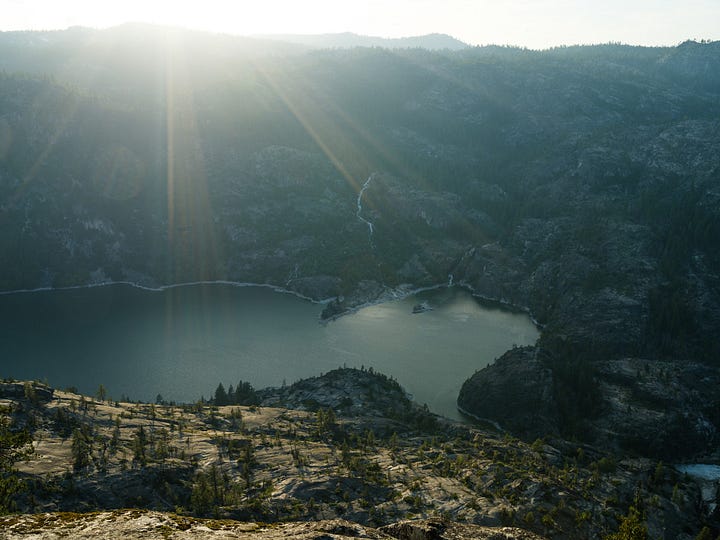 Snow capped mountain peaks and alpine lakes