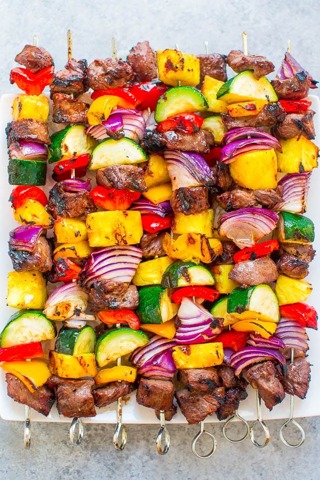 Grilled Steak Kabobs on white serving platter. 