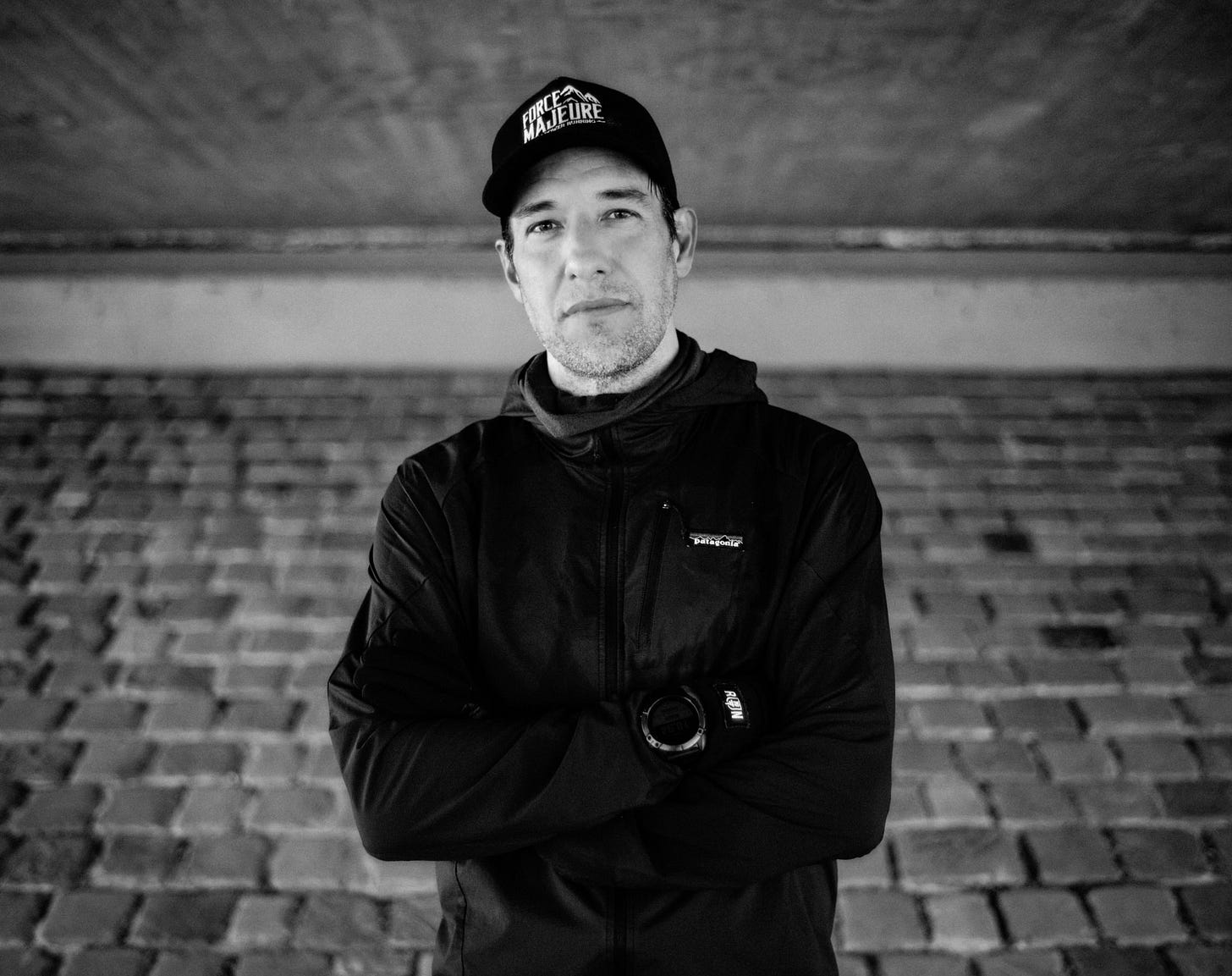 Chris standing under a bridge