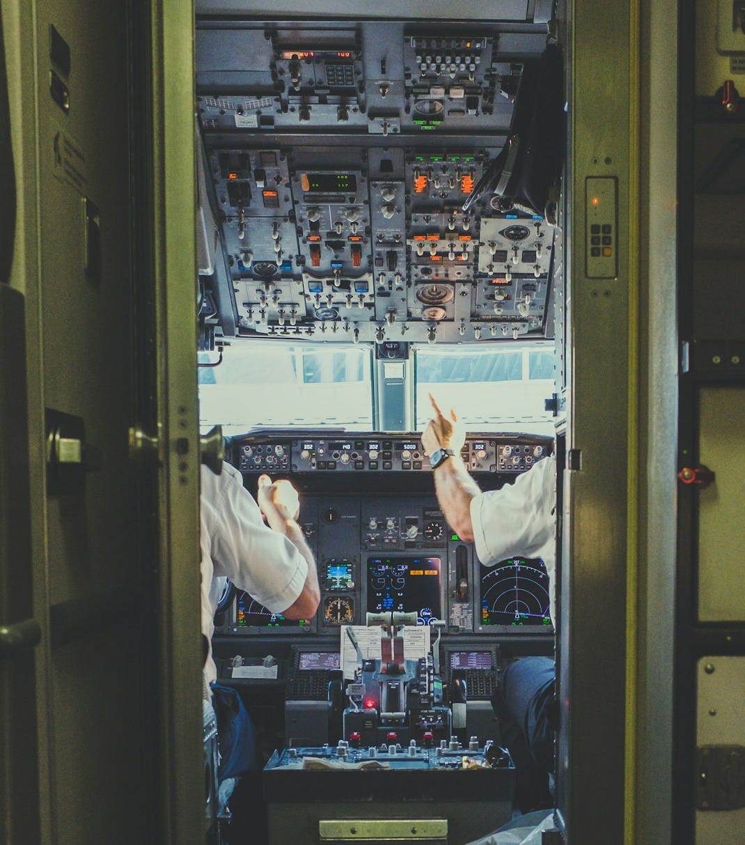 pilot and copilot inside plane cockpit pilot and copilot inside plane cockpit