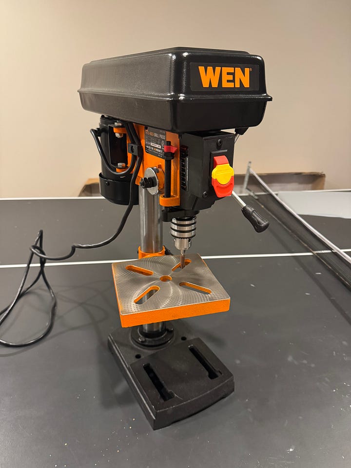 A photograph of a Wen drill press with rubber Cratex abrasive bit as used for creating perlage as in luxury watchmaking.