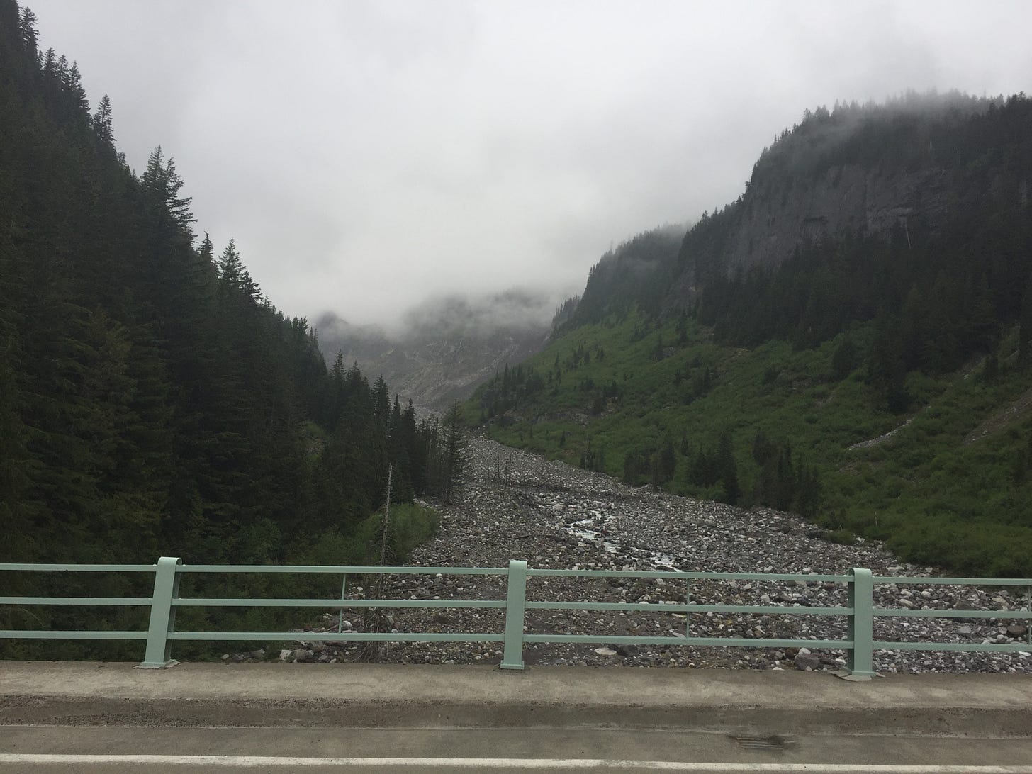 Clouds obscure Mount Rainier, just miles away.