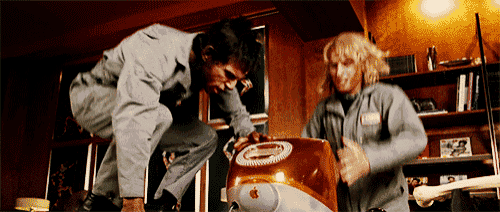 a man and a woman are working on a apple computer a man and a woman are working on a apple computer