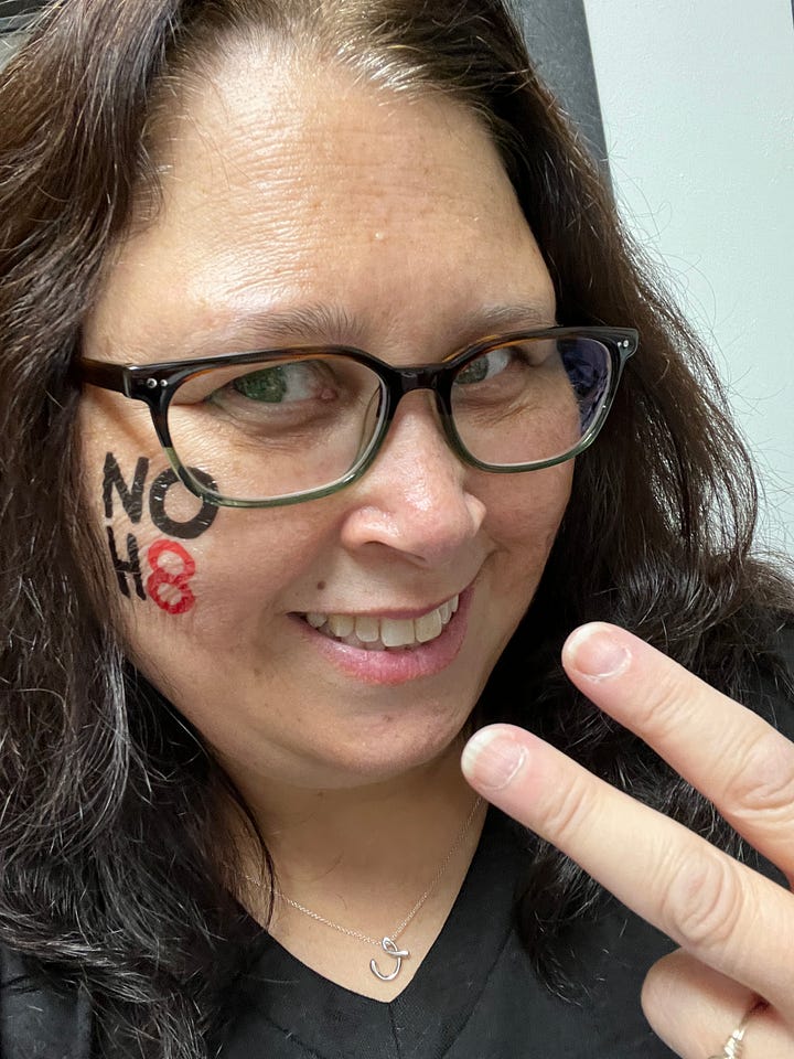 Images of men and women with NOH8 tattoos and shirts