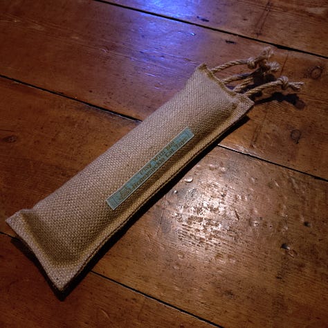 L-R A circular cat scratchy thing, a long thin scratchy thing, a rechargeable self-moving toy