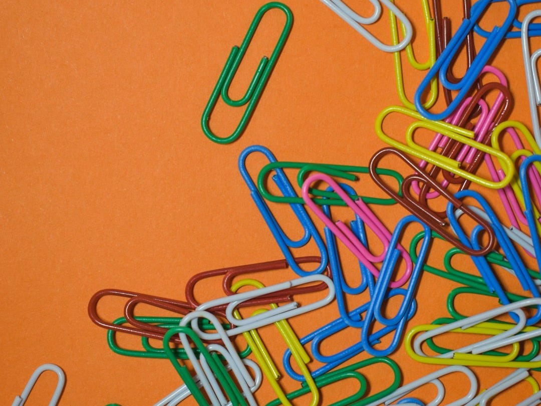 assorted-color safety pin collection