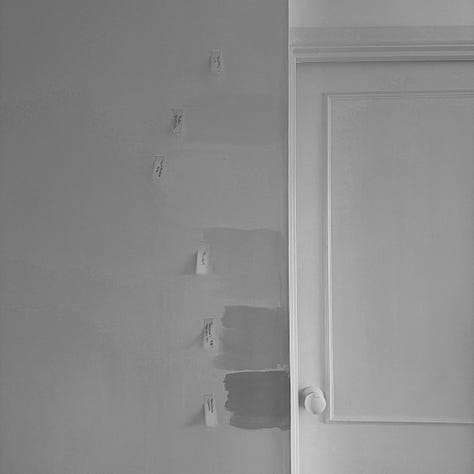 Photographs of a white door and wall with paint samples of different white paints with orange post it notes labelling the paint colours