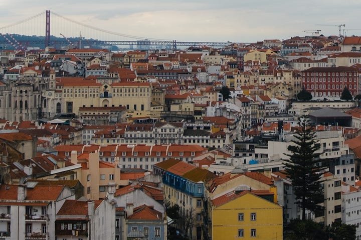 Views over Lisbon rooftops, 25 April bridge and castle do Sao Jorge.