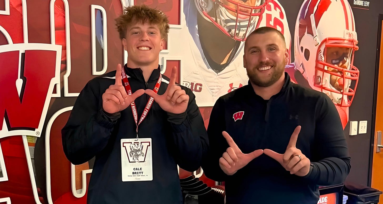 Wisconsin linebacker commit Cale Britt stands with inside linebackers coach Tuf Borland during a recruiting visit.