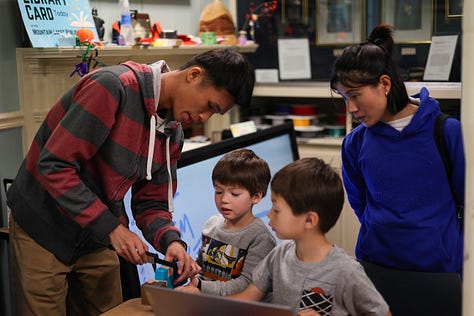 Nine square images from STEM Day, including two students 3d designing, a student sharing his Mars Rover Scratch game, a little kid building with MOLA kit, 3D-Click activities, Tiny robots!, Exploring resources