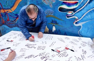 Celebrants sign large card for Ferlinghetti 2 Celebrants sign large card for Ferlinghetti 2