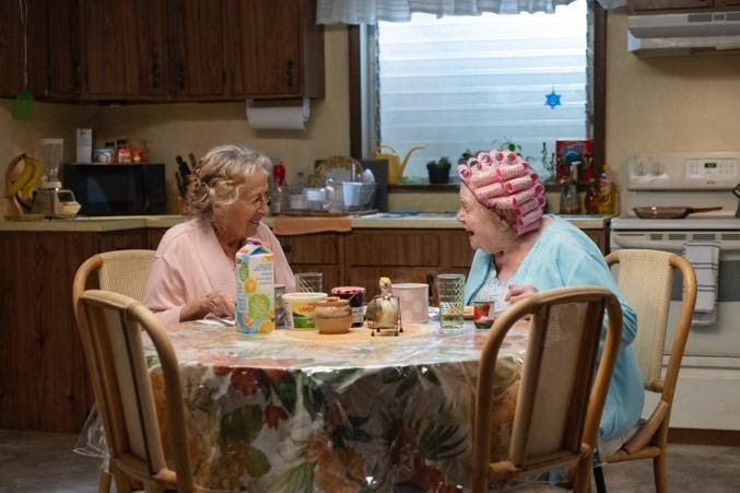 Two women sitting at a table
AI-generated content may be incorrect. Two women sitting at a table
AI-generated content may be incorrect.