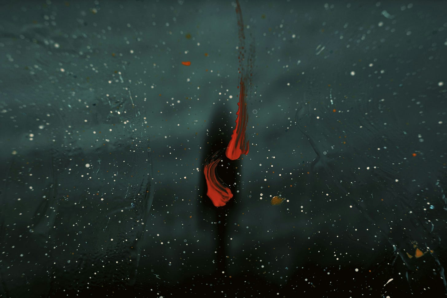 A distorted gray image of a person in the distance, further altered by a slash of red paint