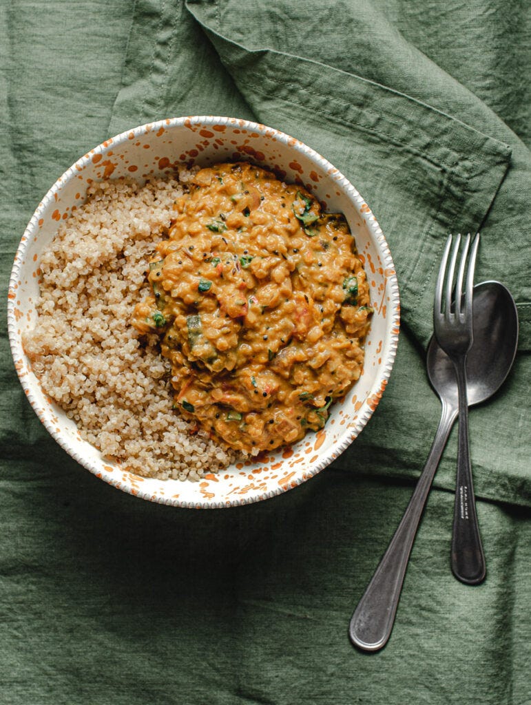 Dahl made from butternut squash in a bowl with a side of quinoa Dahl made from butternut squash in a bowl with a side of quinoa