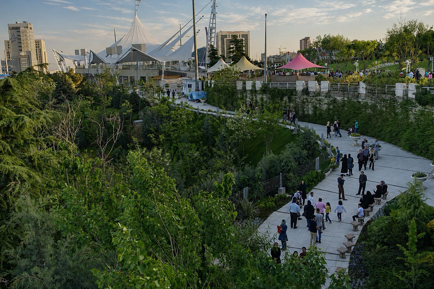 People strolling in the park at Tehran's Tabiat Bridge.