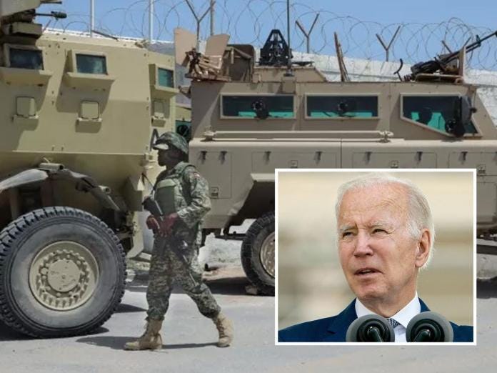 A person walking in front of a military vehicle
Description automatically generated A person walking in front of a military vehicle
Description automatically generated