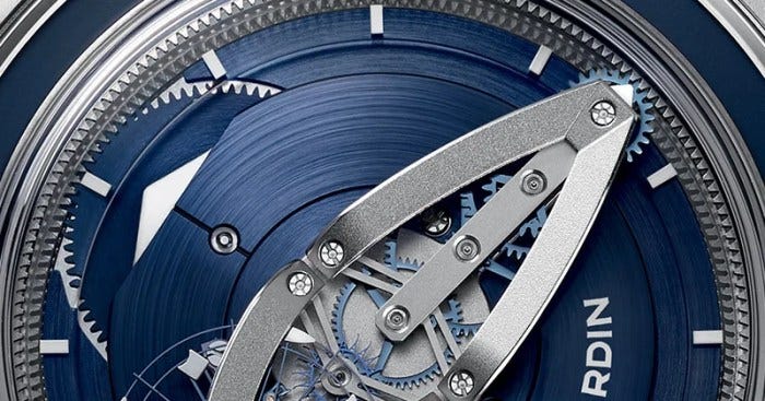 The large triangle on the left advances to indicate the hours, while the shaped-bridge on the right rotates to show the minutes. The large triangle on the left advances to indicate the hours, while the shaped-bridge on the right rotates to show the minutes.