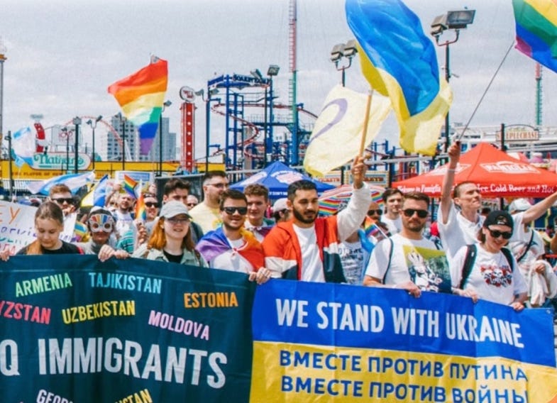 A group of people holding signs

AI-generated content may be incorrect.