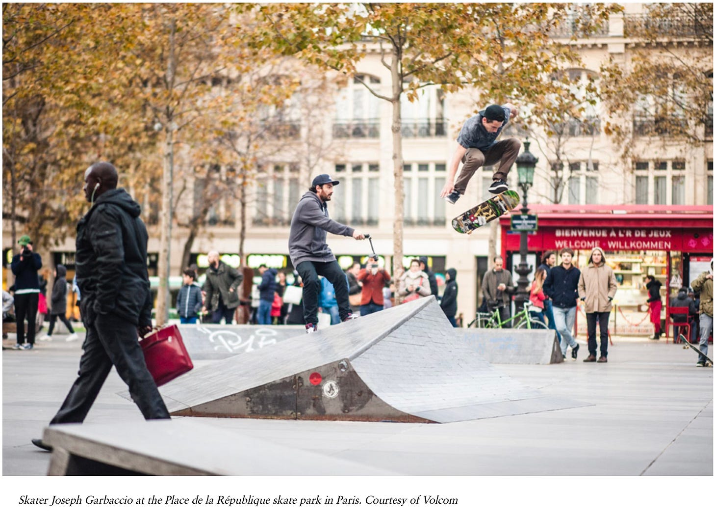 a skater flies off a ramp at the Place de la Republique skate park in Paris