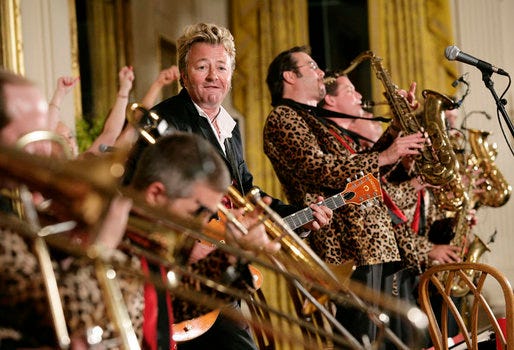 Guitarist-singer Brian Setzer plays with his orchestra Thursday evening, June 29, 2006 in the East Room of the White House, during the entertainment following the official dinner in honor of Japanese Prime Minister Junichiro Koizumi’s visit to the United States. White House photo by Eric Draper