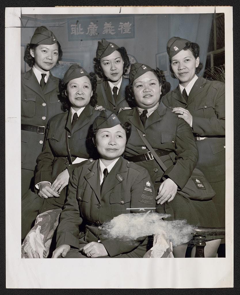 Chinese-American women serving with the American Women's Voluntary Services (AWVS) in Chinatown, New York City, 1942. Pictured are members including chairman Mrs. Josephine Hong. Chinese-American women serving with the American Women's Voluntary Services (AWVS) in Chinatown, New York City, 1942. Pictured are members including chairman Mrs. Josephine Hong.