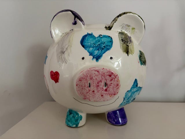 pig-shaped pieggy bank painted with hearts