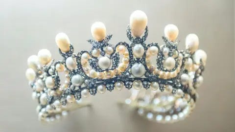 Alamy Close up photo of ornate pearl and diamond tiara worn by Empress Eugenie as displayed at the Louvre Museum, Paris