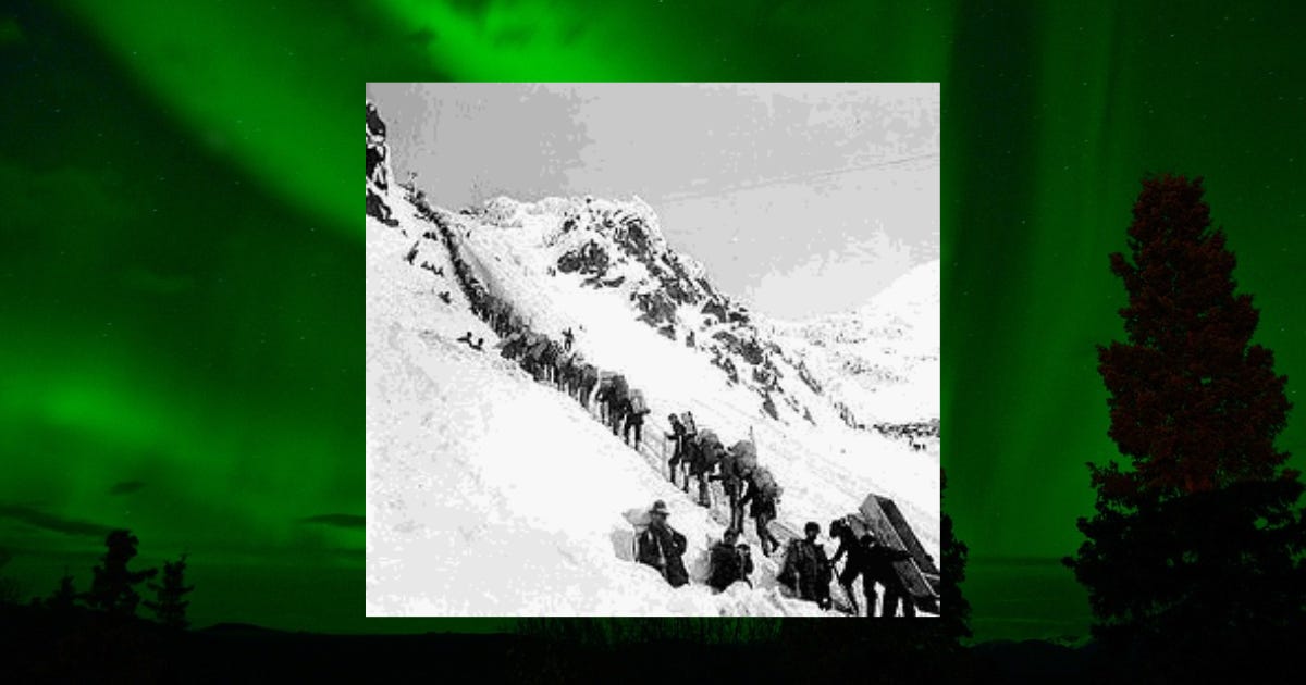 A hard climb up the steep Chilkoot Pass during the Skagway, Alaska gold rush.