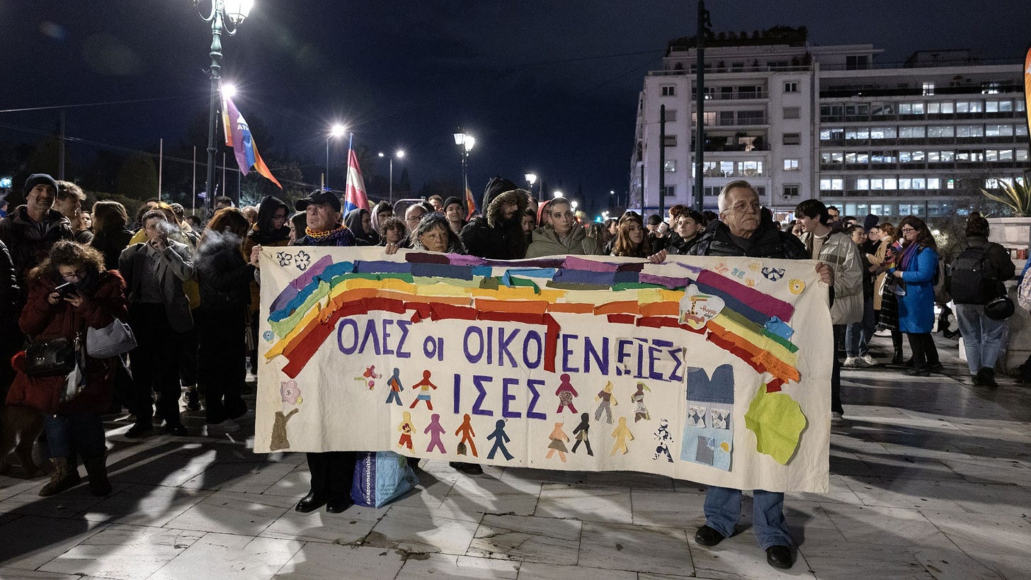 Protesters hold a banner reading All families should be equal during a rally in favor of the samesex marriage bill in...