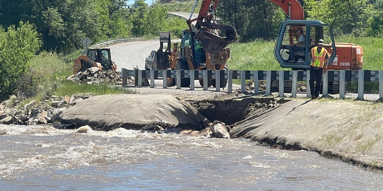 Water Flows by Belfry and Edgar; Elsewhere Emergency Repairs are Necessary to Save Roads and Bridge