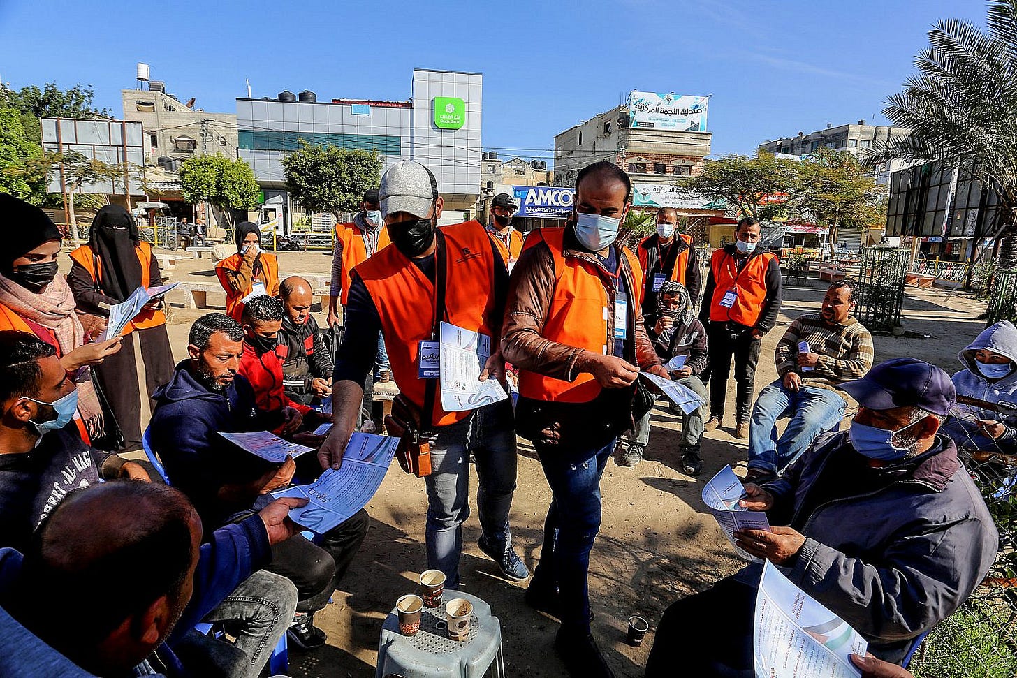 Palestinian Central Election Commission workers register citizens in preparation for May elections, in Rafah, in the southern Gaza Strip, Feb. 10, 2021. (Abed Rahim Khatib/Flash90)
