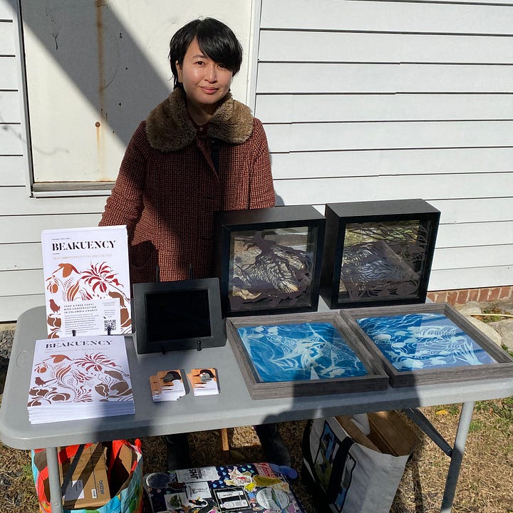Photos of the author and a community member at CREATE Council on the Arts open house event.