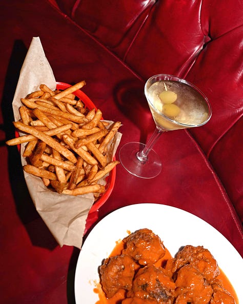 in: cute clients, wood paneled walls, no upcharge for non dairy milk, plush red booths + filthy tinis