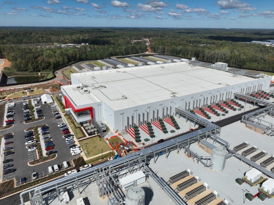 An aerial shot shows the entrance to the immense datacenter, which has two stories.